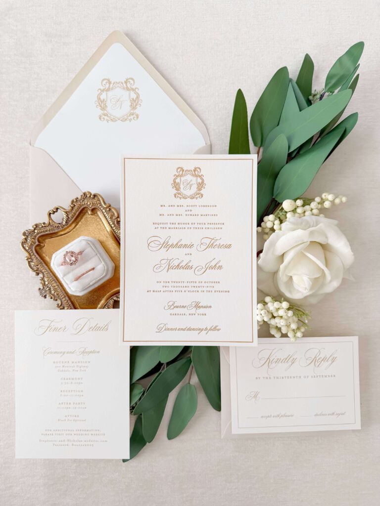Formal wedding invitation suite with gold letterpress printing and a tan envelope