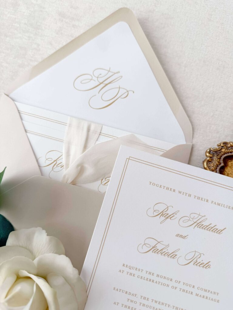 Wedding invitation envelope liner featuring an elegant script monogram