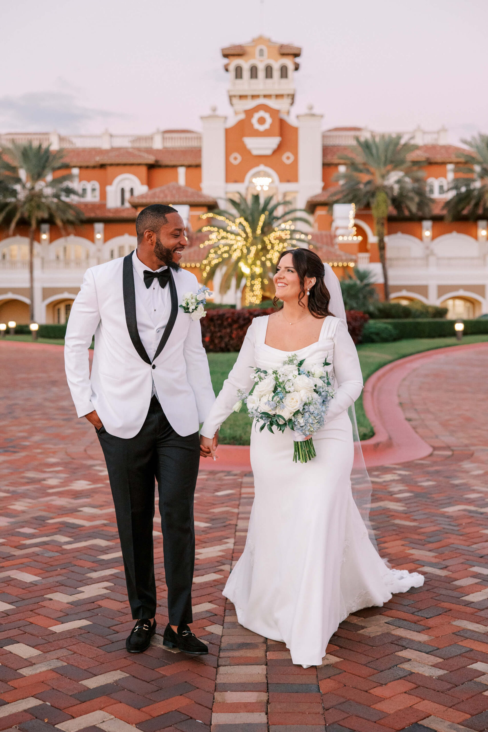 Portrait of bride and groom in front of Crane Club at Tesoro