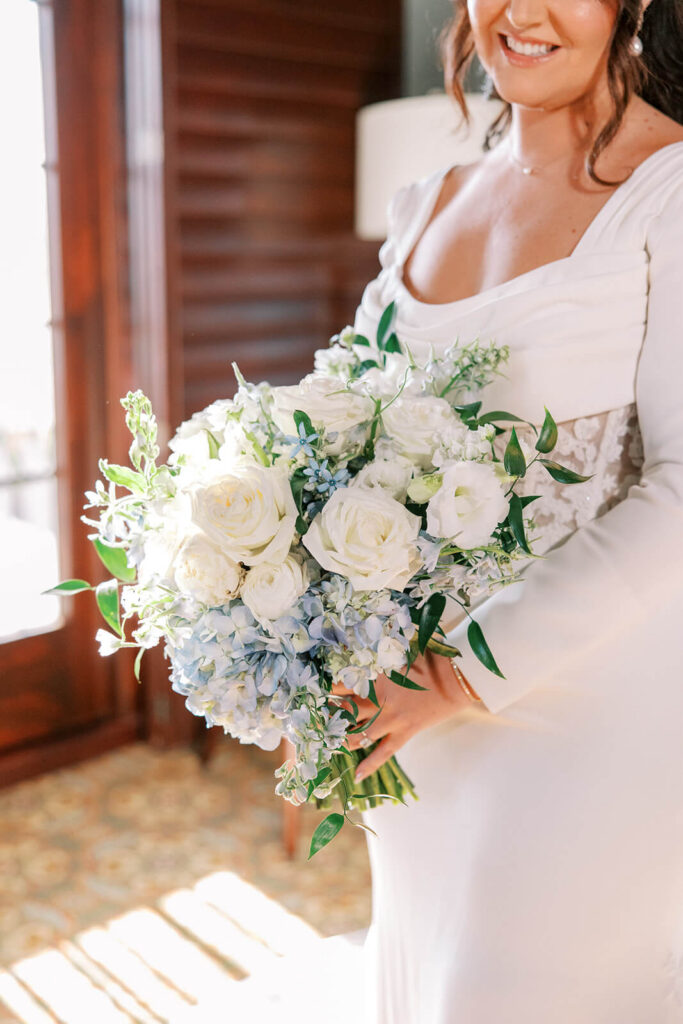 Bridal bouquet of white and blue flowers