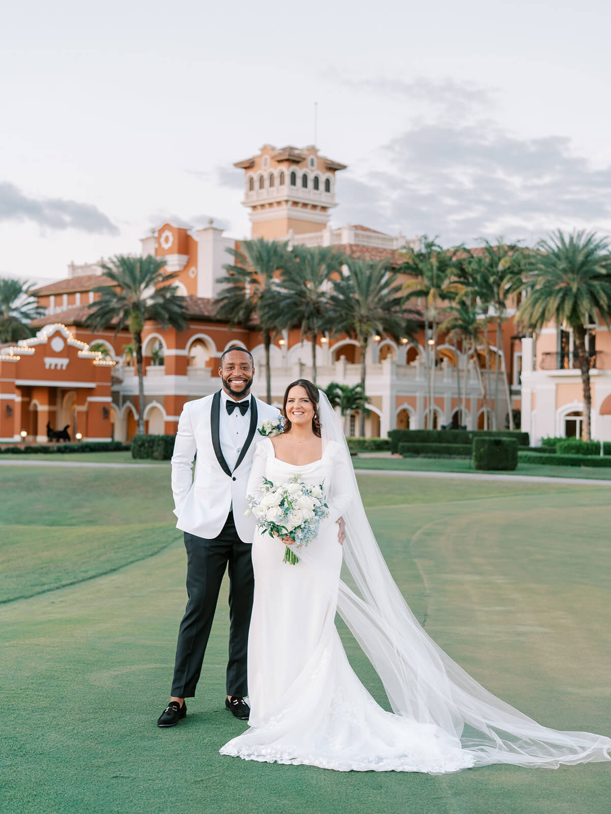 Portrait of bride and groom in front of Crane Club at Tesoro on their wedding day