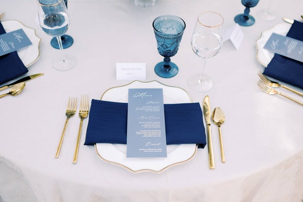 Elegant tablescape in shades of blue with a French blue menu card