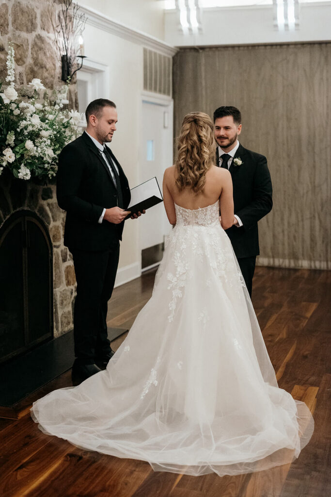 Wedding ceremony in front of a stone hearth