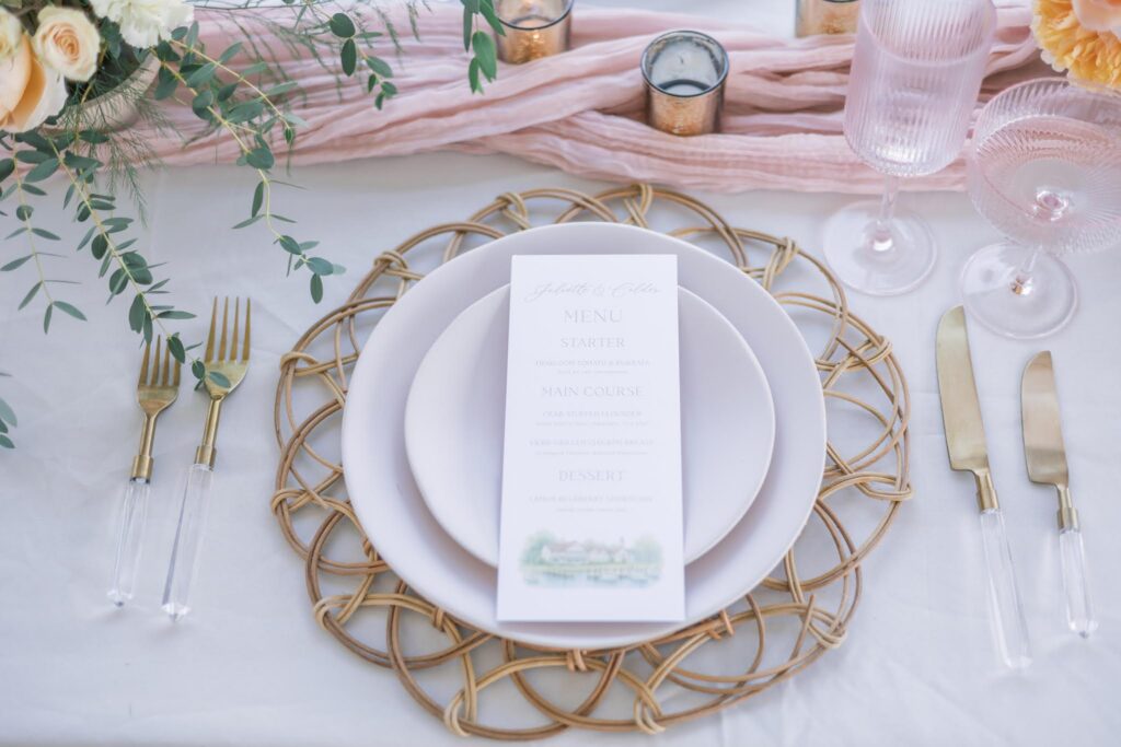 Natural woven charger with a wedding menu card and pink table runner