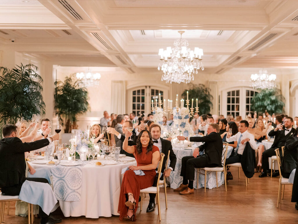 Guests toast during the wedding reception