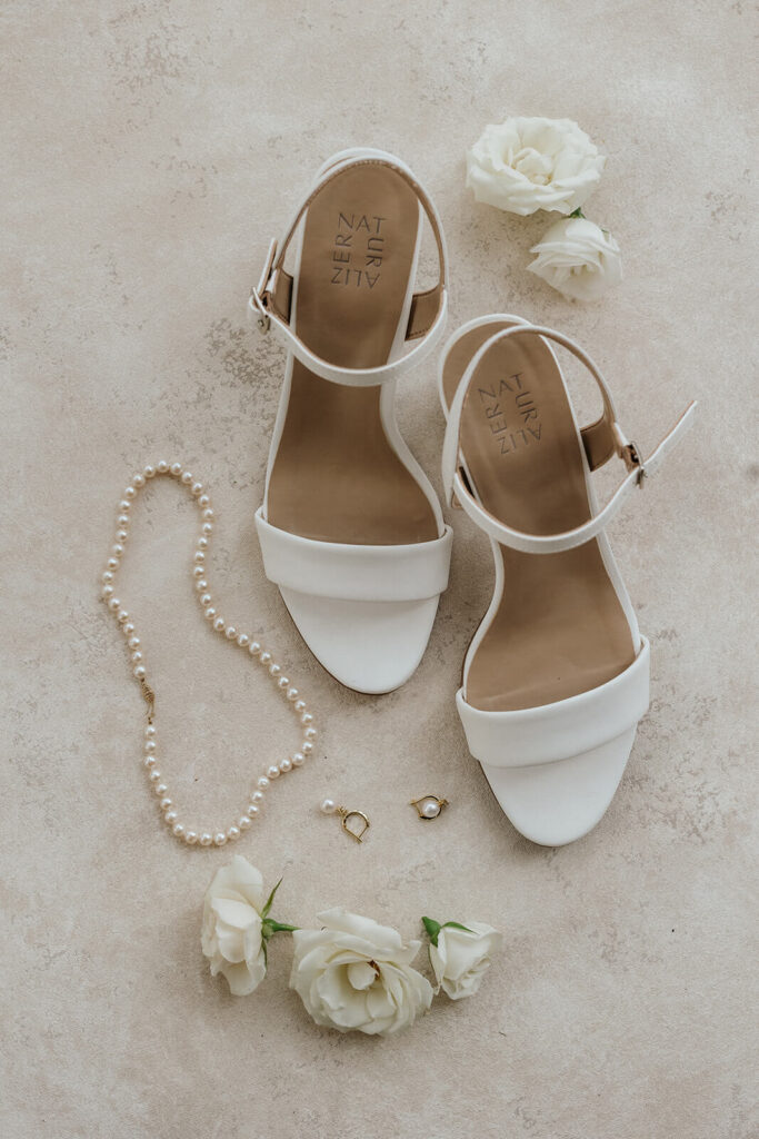 Wedding details shot of bridal accessories and shoes