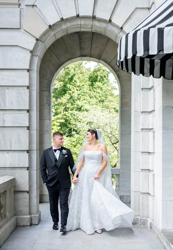 Bride and groom holding hands on their wedding day at Elkins Estate wedding and event venue