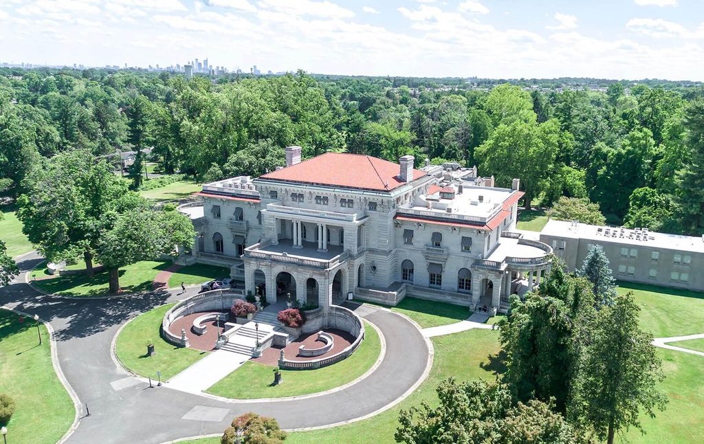 Elstowe Manor at Elkins Estate with the Philadelphia skyline visible in the background.