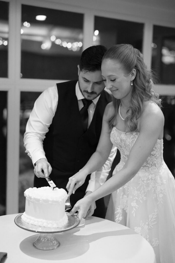 Bride and groom cutting their wedding cake