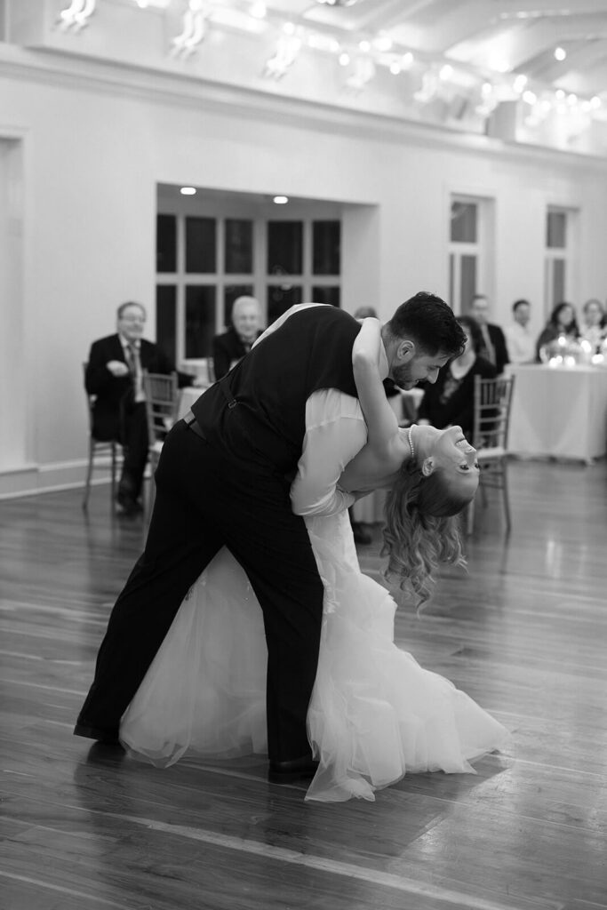 Groom dipping the bride during their first dance