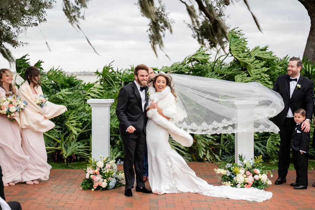 Windy outdoor ceremony in the wedding garden at Adams Estate 