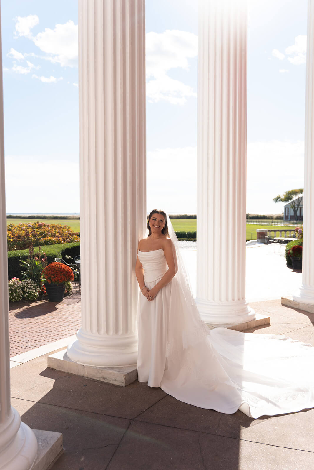 Bridal portrait by the columns of Bourne Mansion