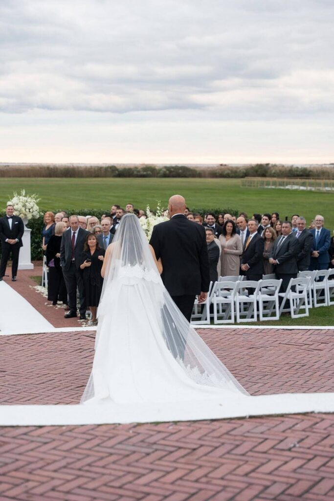 Bride and father walking down the aisle