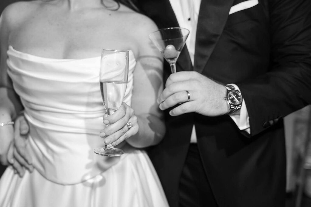 Bride and groom with cocktails on their wedding day