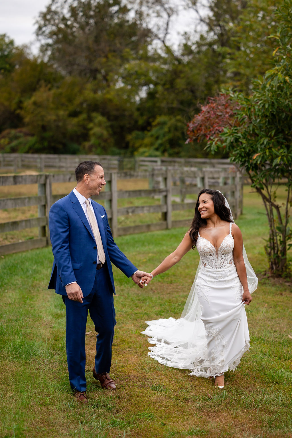 Bride and groom holding hands at their Cecil Creek Farm wedding