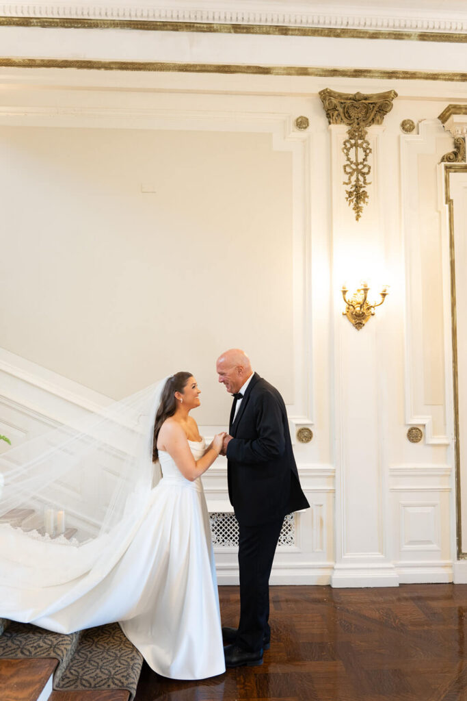 Emotional first look between father and daughter on her wedding day