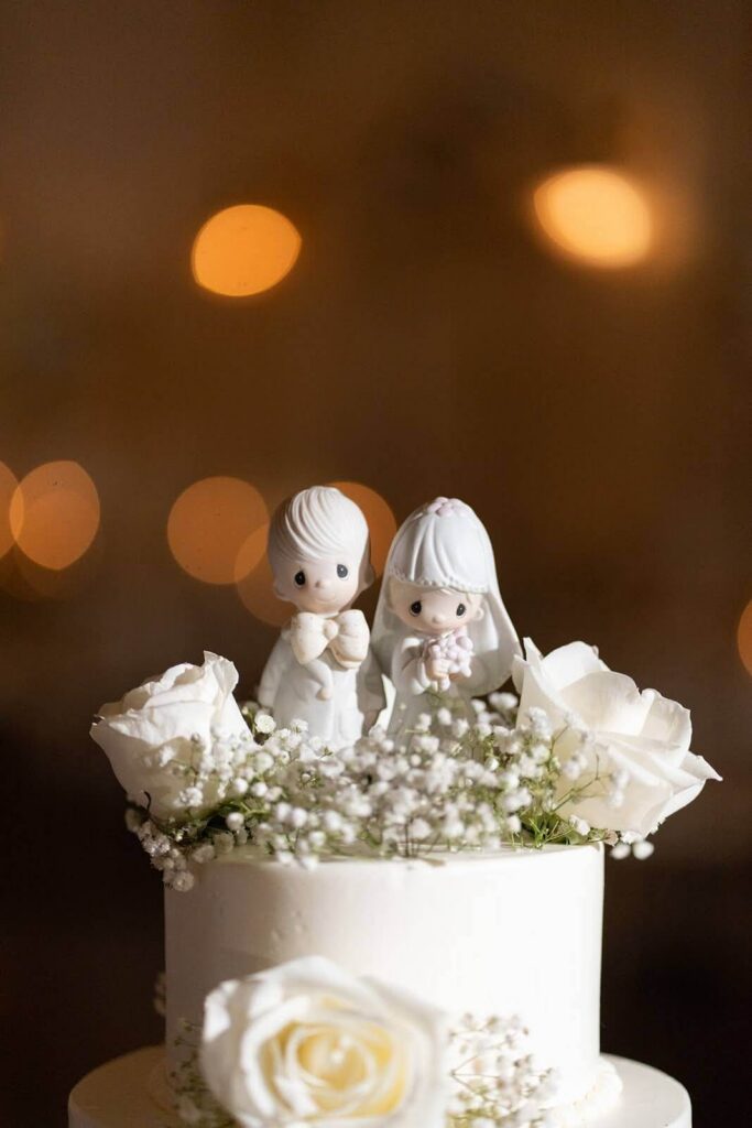 Precious Moments wedding topper of a little boy and girl
