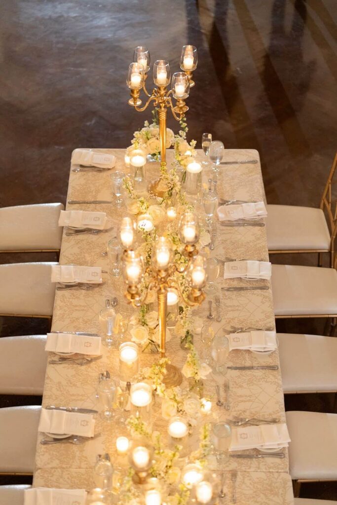Elegant and romantic wedding tablescape with gold candelabras