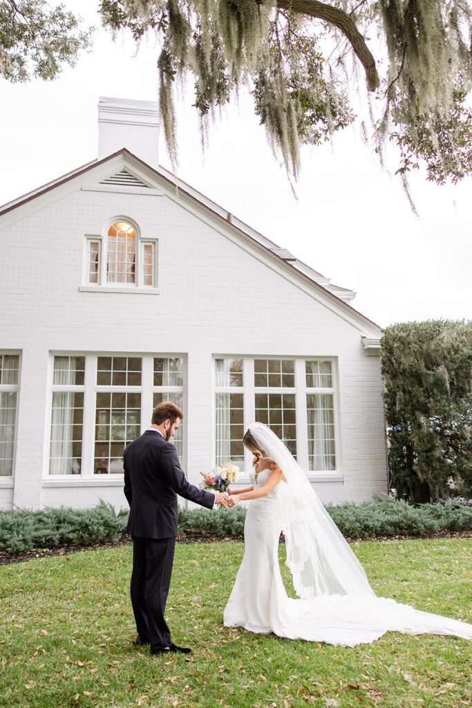 Bride and groom first look outside Adams Estate on their wedding day