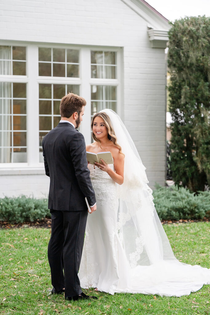 Bride and groom private vow reading outside Adams Estate on their wedding day
