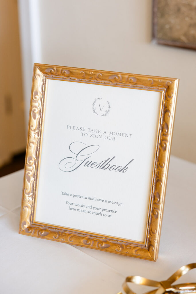 Wedding guestbook sign in an elegant gold frame