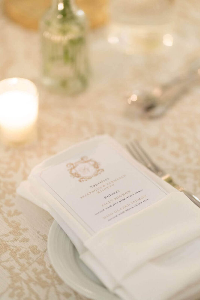 Wedding menu card with ornate custom crest