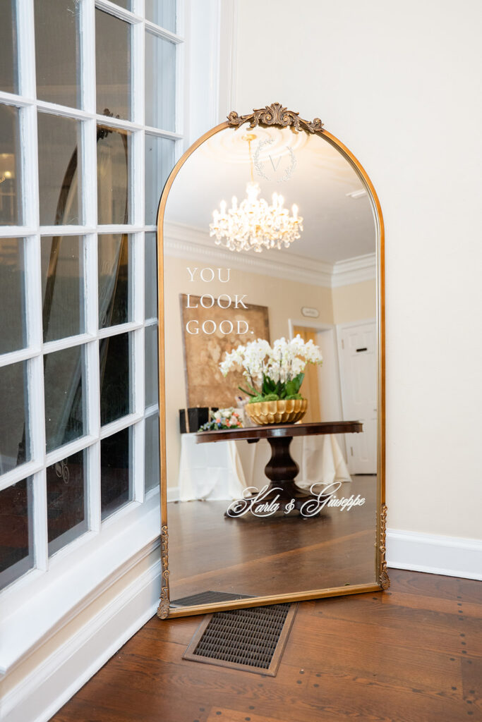 Elegant gilded mirror with the words "You look good" for guests