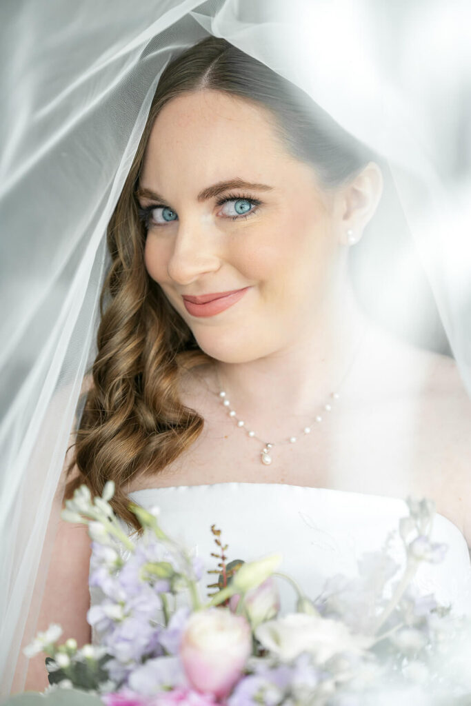 Portrait of the bride on her wedding day wearing a strapless gown