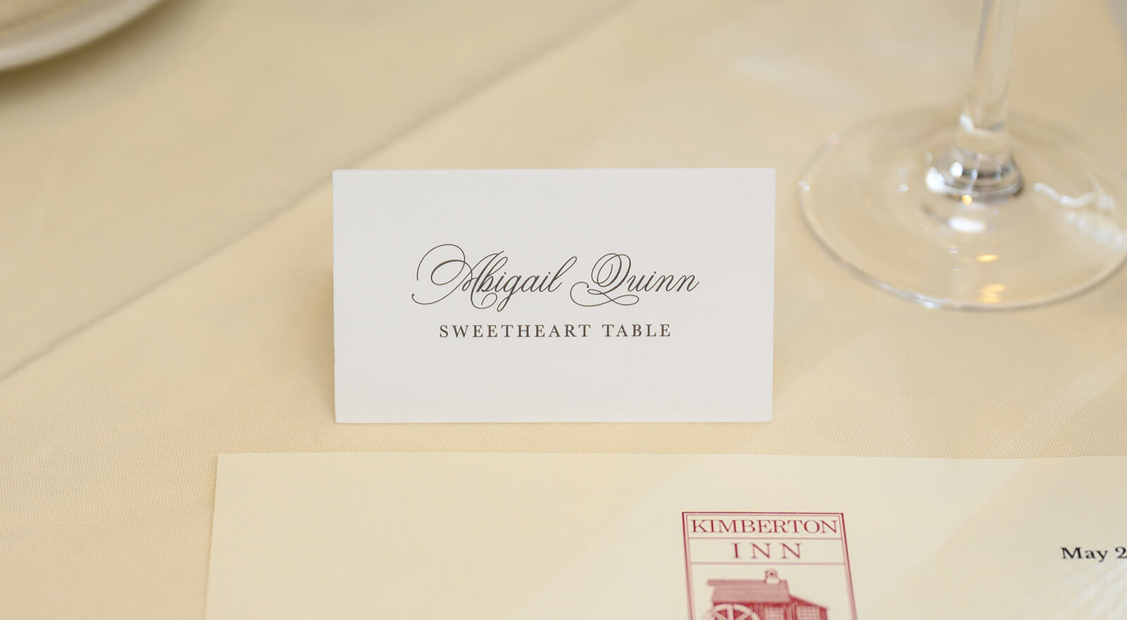 Traditional escort card with elegant script font