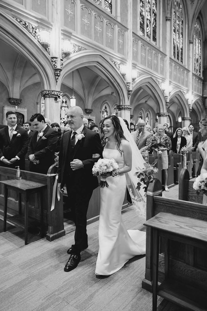 Father escorting the bride down the aisle