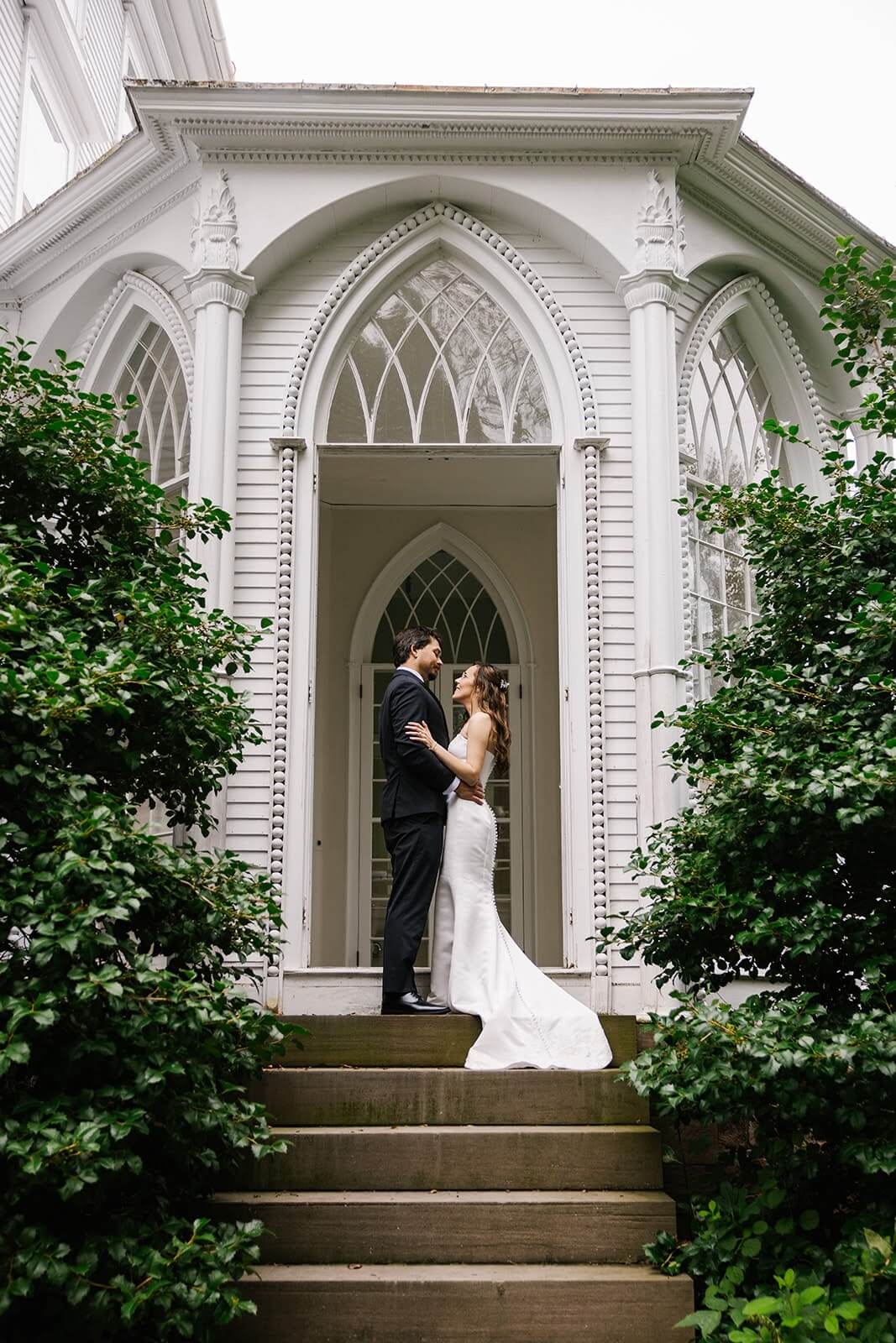 Bride and groom embracing on their wedding day at Rhode Island mansion Linden Place