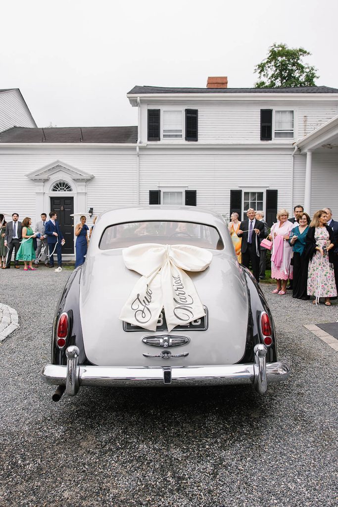 Vintage Rolls Royce with "Just Married" bow on the back, arriving at Linden Place