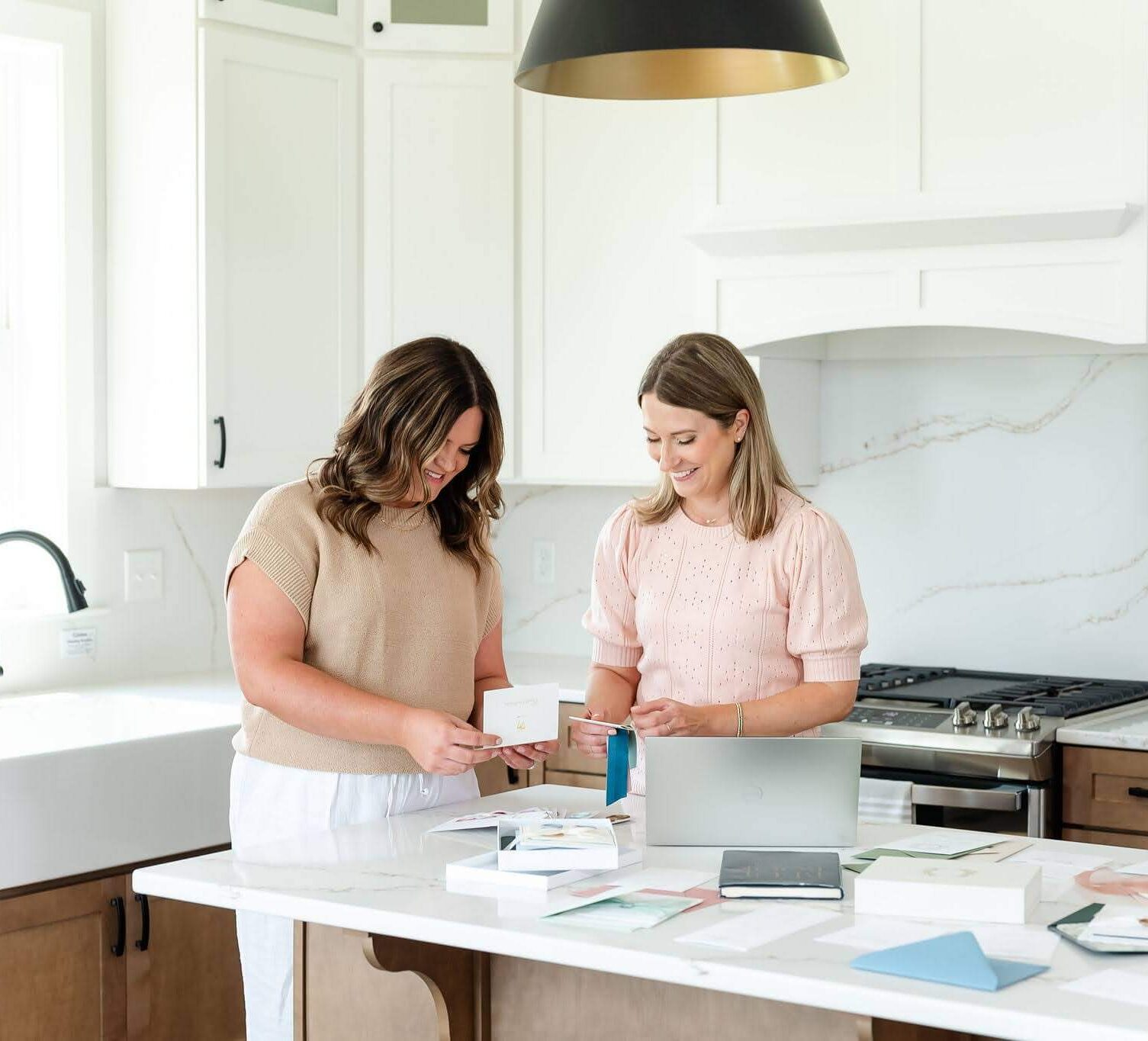 Custom wedding stationery designers Emily and Heather of Heather Paperie, ready to design invitations for busy couples